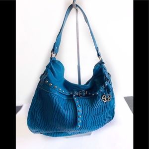 Marc Ecko Red Teal handbag with gold emblem.